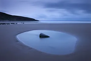Rockpool on the sandy Southerndown beach at dawn, Dunraven Bay, Glamorgan Heritage Coast Rockpool on the sandy Southerndown beach at dawn, Dunraven Bay, Glamorgan Heritage Coast