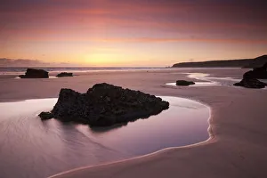 Rockpools on the sandy shores of Bedruthan Steps at sunset Cornwall, England. Spring Rockpools on the sandy shores of Bedruthan Steps at sunset Cornwall, England. Spring