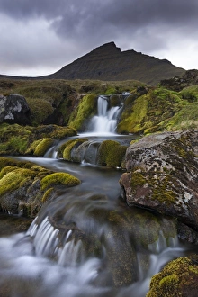 Rocky stream with waterfalls below Slaettaratindur mountain, Eysturoy, Faroe Islands, Europe Rocky stream with waterfalls below Slaettaratindur mountain, Eysturoy, Faroe Islands, Europe