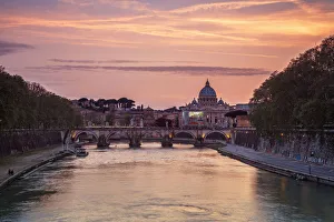 A romantic sunset on Tiber River with bridge Umberto I and Basilica di San Pietro A romantic sunset on Tiber River with bridge Umberto I and Basilica di San Pietro