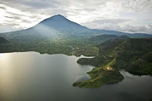 Rwanda. Lake Burero reaches out underneath the volcanoes Rwanda. Lake Burero reaches out underneath the volcanoes
