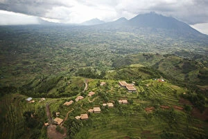 Related Images Collection: Rwanda. The luxurious Virunga Safari Lodge sits below looming volcanoes