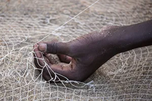 Salima, Malawi Lake, Africa. Hand of a net weaver Salima, Malawi Lake, Africa. Hand of a net weaver