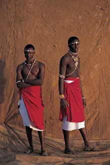 Samburu warriors, infront of muddy backdrop at Sunset, Laikipia Kenya Samburu warriors, infront of muddy backdrop at Sunset, Laikipia Kenya