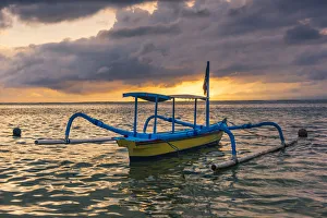 Sanur, Denpasar, Bali, Indonesia. Traditional jukung (fishing boat) at Sanur Beach Sanur, Denpasar, Bali, Indonesia. Traditional jukung (fishing boat) at Sanur Beach