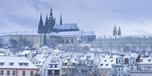 Scenic view of Prague Castle and snow-covered roofs in winter, Prague, Bohemia Scenic view of Prague Castle and snow-covered roofs in winter, Prague, Bohemia