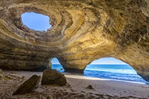 The sea caves of Benagil with natural windows on the clear waters of the Atlantic The sea caves of Benagil with natural windows on the clear waters of the Atlantic