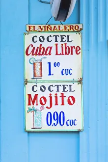A sign hanging outside a bar in Vinales Town, Pinar del Rio Province, Cuba A sign hanging outside a bar in Vinales Town, Pinar del Rio Province, Cuba