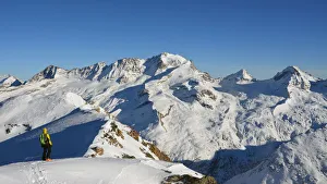 Ski mountaineers with Grand Paradiso on background (from Entrelor summit), Rhemes Valley Ski mountaineers with Grand Paradiso on background (from Entrelor summit), Rhemes Valley