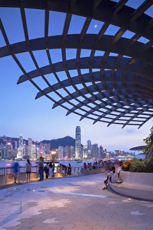 Skyline of Hong Kong Island and Tsim Sha Tsui promenade at sunset, Hong Kong Skyline of Hong Kong Island and Tsim Sha Tsui promenade at sunset, Hong Kong