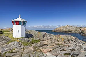 Small lighthouse in the harbor of Landsort on the archipelago island of Öja Small lighthouse in the harbor of Landsort on the archipelago island of Öja