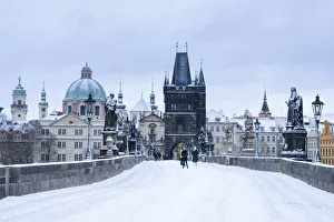 Snow-covered Charles Bridge and Old Town Bridge Tower in winter, Prague, Bohemia Snow-covered Charles Bridge and Old Town Bridge Tower in winter, Prague, Bohemia