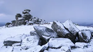 Snow covered granite rocks at Great Staple Tor, Dartmoor, Devon, England. Winter Snow covered granite rocks at Great Staple Tor, Dartmoor, Devon, England. Winter