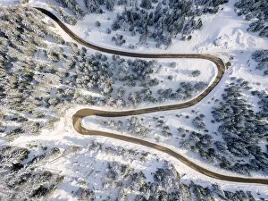 Snowy road aerial view, Passo Delle Erbe ,Funes Valley, South Tyrol, Italy Snowy road aerial view, Passo Delle Erbe ,Funes Valley, South Tyrol, Italy