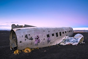 Solheimasandur beach, Southern Iceland. The crashed DC-3 plane on the black sand Solheimasandur beach, Southern Iceland. The crashed DC-3 plane on the black sand