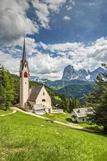 St. Jakob church with Langkofel - Sassolungo mountain group in the background St. Jakob church with Langkofel - Sassolungo mountain group in the background