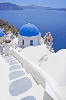Staircase leading to blue domed church overlooking ocean, Oia, Santorini, Cyclades Staircase leading to blue domed church overlooking ocean, Oia, Santorini, Cyclades
