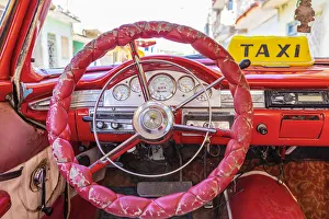 Steering wheel and dashboard in a classic car in Trinidad, Sancti Spiritus, Cuba Steering wheel and dashboard in a classic car in Trinidad, Sancti Spiritus, Cuba