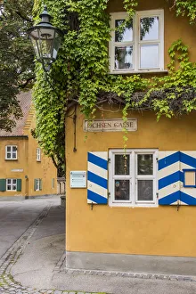 Street view of the Fuggerei settlemment, the worlds oldest social housing complex Street view of the Fuggerei settlemment, the worlds oldest social housing complex