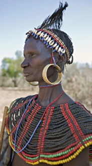 A striking old Pokot woman wearing the traditional beaded ornaments of her tribe which denote her married status A striking old Pokot woman wearing the traditional beaded ornaments of her tribe which denote her married status