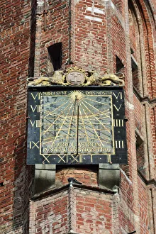 Sun clock in a historical house in Dlugi Targ, the Long Market Street, in the Old Sun clock in a historical house in Dlugi Targ, the Long Market Street, in the Old