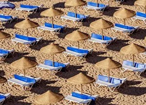 European Coastal Landmarks Prints: Sunbeds at Paneco Beach, elevated view, Albufeira, Algarve, Portugal