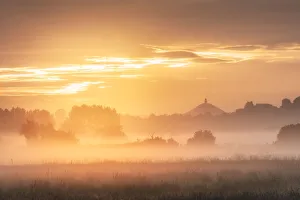 Sunrise over Glastonbury Tor, Somerset Levels, Somerset, England, UK Sunrise over Glastonbury Tor, Somerset Levels, Somerset, England, UK