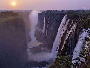 Victoria Falls Collection: Sunset over the magnificent Victoria Falls