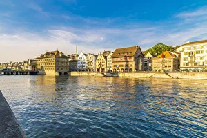 Sunset over the old buildings of Limmatquai, old street along Limmat River, Zurich Sunset over the old buildings of Limmatquai, old street along Limmat River, Zurich