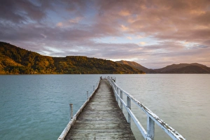Sunset over picturesque wharf in idyllic Kenepuru Sound, Marlborough Sounds, South Island Sunset over picturesque wharf in idyllic Kenepuru Sound, Marlborough Sounds, South Island