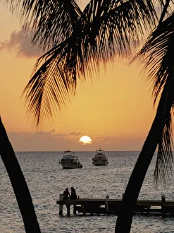 Sunset seen from Seven Mile Beach, West Bay, Grand Cayman, Cayman Islands Sunset seen from Seven Mile Beach, West Bay, Grand Cayman, Cayman Islands