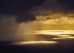 Sunset with stormy sky seen from Orongo Village, Rapa Nui National Park, Easter Island Sunset with stormy sky seen from Orongo Village, Rapa Nui National Park, Easter Island