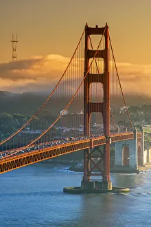 Sunset view over the Golden Gate with fog in the background, San Francisco, California Sunset view over the Golden Gate with fog in the background, San Francisco, California