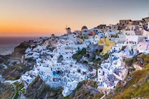 Sunset at the village of Oia in Santorini, Cyclades Islands, Greece Sunset at the village of Oia in Santorini, Cyclades Islands, Greece