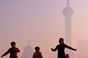 Tai Chi exercises at sunrise, The Bund, Shanghai China Tai Chi exercises at sunrise, The Bund, Shanghai China