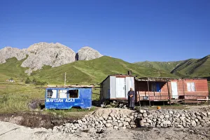 A Tajik woman stands outside her home on the Pamir Highway; Tajikistan A Tajik woman stands outside her home on the Pamir Highway; Tajikistan