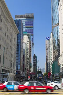 Taxis passing Nathan Road, Tsim Sha Tsui, Hong Kong Taxis passing Nathan Road, Tsim Sha Tsui, Hong Kong