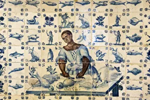 Tiles representing a black woman preparing fish Tiles representing a black woman preparing fish