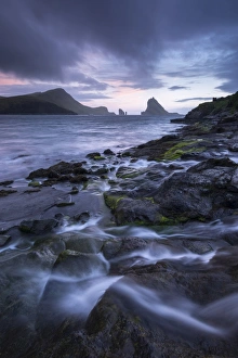 Tindholmur at sunset from Bour on the island of Vagar, Faroe Islands, Denmark. Summer Tindholmur at sunset from Bour on the island of Vagar, Faroe Islands, Denmark. Summer