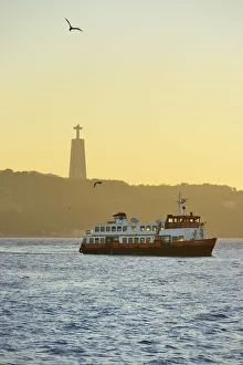 A traditional passenger boat (cacilheiro) crossing the Tagus river between Almada A traditional passenger boat (cacilheiro) crossing the Tagus river between Almada
