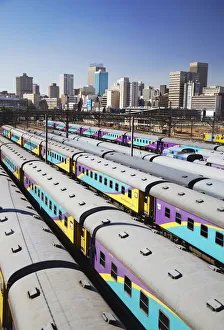 Train carriages at Park Station with city skyline in background, Johannesburg, Gauteng Train carriages at Park Station with city skyline in background, Johannesburg, Gauteng