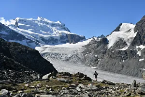 European Trekking Routes Prints: Trekker with Grand Combin on background, Switzerland, Swiss