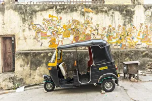 Tuk-tuk and wall mural, Udaipur, Rajasthan, India Tuk-tuk and wall mural, Udaipur, Rajasthan, India