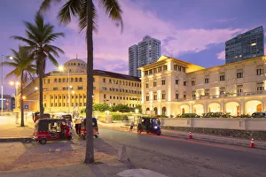 Tuk tuks parked outside Galle Face Hotel at sunset, Colombo, Sri Lanka Tuk tuks parked outside Galle Face Hotel at sunset, Colombo, Sri Lanka