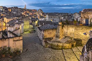Typical paved alley in the old Sassi quarter at dusk. Matera, Basilicata region, Italy Typical paved alley in the old Sassi quarter at dusk. Matera, Basilicata region, Italy