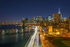USA, New York, Lower Manhattan Skyline and Brooklyn Bridge over East River USA, New York, Lower Manhattan Skyline and Brooklyn Bridge over East River