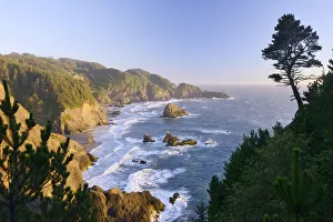USA, West Coast, Oregon, State Scenic Corridor, Sunset with waves crashing USA, West Coast, Oregon, State Scenic Corridor, Sunset with waves crashing