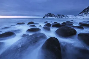 Uttakleiv beach during a cloudy sunset in the Lofoten islands, Norway Uttakleiv beach during a cloudy sunset in the Lofoten islands, Norway