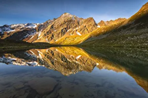 Valmalza lake during a sunrise in Camonica valley, Ponte di Legno, Brescia province Valmalza lake during a sunrise in Camonica valley, Ponte di Legno, Brescia province