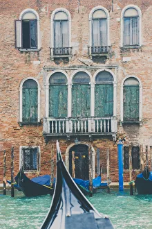 Venice, Veneto, Italy. Gondolas and waterfront palace Venice, Veneto, Italy. Gondolas and waterfront palace